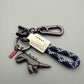 🦖🔑Lega di alluminio Dinosauro Charm accoppiato con un braccialetto tessuto a mano