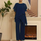 Completo composto da affascinante top irregolare e pantaloni a gamba larga
