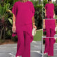 Completo composto da affascinante top irregolare e pantaloni a gamba larga