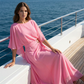Set con top con maniche a mantella fluide e pantaloni avvolgenti
