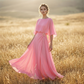 Set con top con maniche a mantella fluide e pantaloni avvolgenti