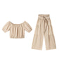 Set di due pezzi composto da top con spalle scoperte e maniche a sbuffo e pantaloni a gamba larga