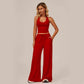 Completo da donna composto da top corto con scollo all'americana e pantaloni a gamba larga.