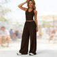 Completo da donna composto da top corto con scollo all'americana e pantaloni a gamba larga.