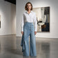 Gonna e pantaloni in denim asimmetrici a portafoglio