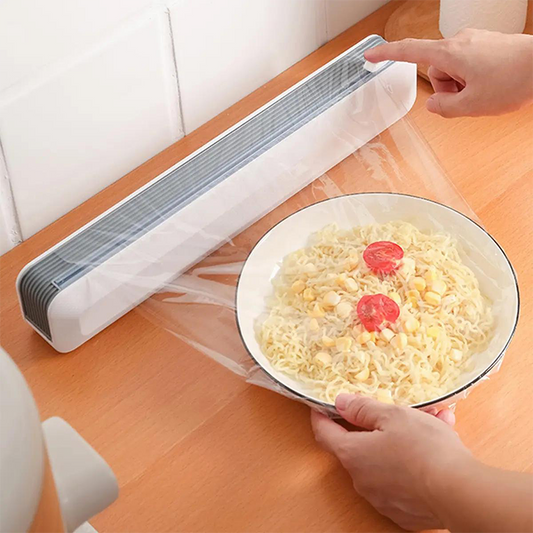 Dispenser magnetico per pellicola trasparente con taglierina a scorrimento