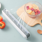 Dispenser magnetico per pellicola trasparente con taglierina a scorrimento