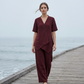 Completo da Donna con Top Asimmetrico e Pantaloni a Gamba Larga