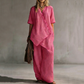 Completo da Donna con Top Asimmetrico e Pantaloni a Gamba Larga